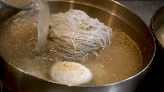 Cold broth over buckwheat noodles