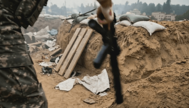 Wounded soldier advancing with rifle on battlefield