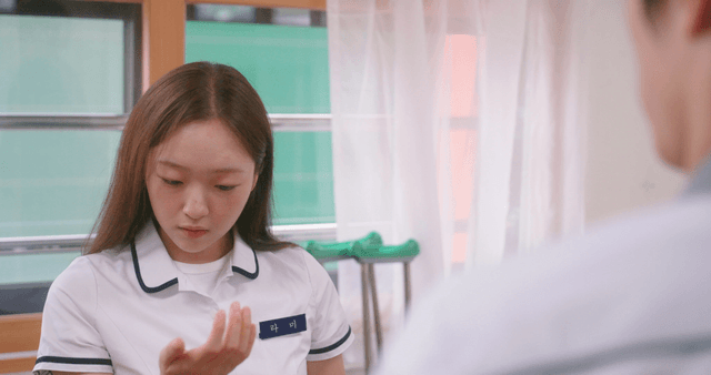 Schoolgirl confused while looking at her hand