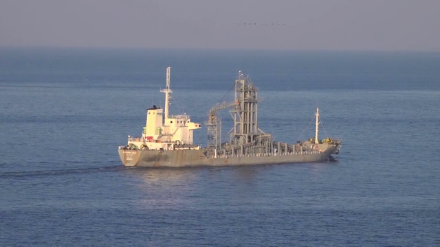 A large cargo ship sailing on the sea