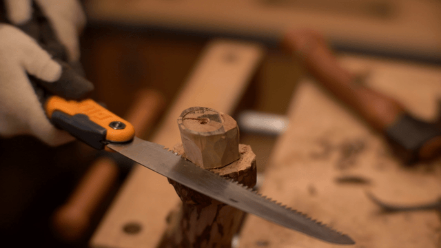 Wood being carefully sawed in a workshop