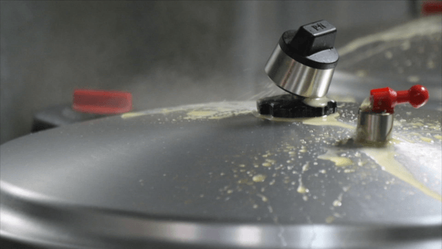 Steam escaping from a pressure cooker