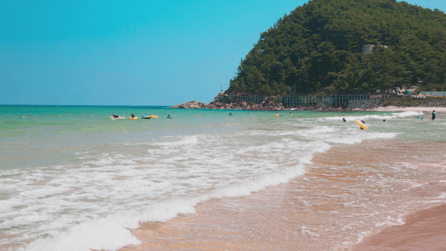 People enjoying water play at beach