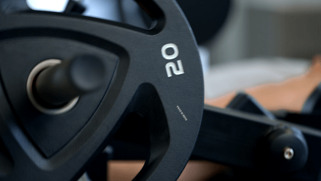 Leg extension weightlifting equipment in a gym