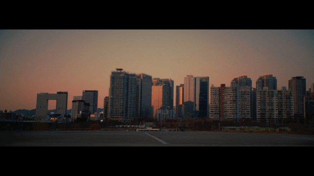 City skyline at sunset with tall buildings