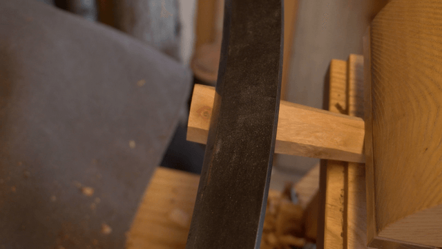 Wood branch finely carved with a drawknife