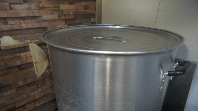 Steaming large pot placed on the stove