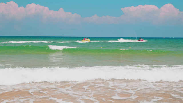 Jet ski towing tube toward open sea