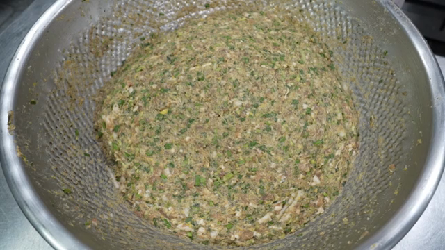 A bowl of mixed ingredients for dumplings