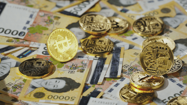 Korean won bills and cryptocurrency coins