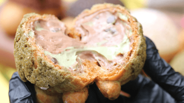Splitting cream-filled bread by hand