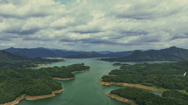 Vast lake surrounded by lush mountains