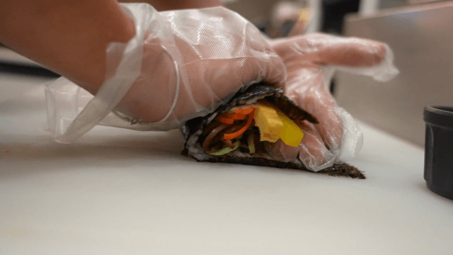 Preparing kimbap with various ingredients