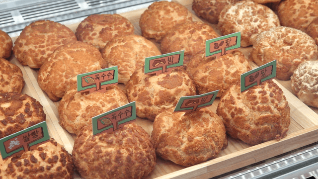 Various types of bread displayed at a bakery