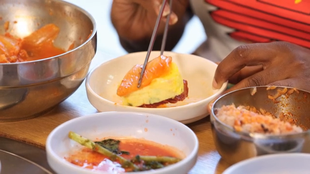 Rolled omelet served with kimchi