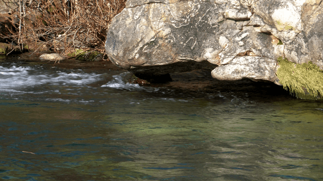 Rocky riverside with flowing water