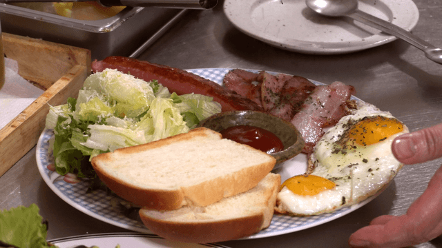 Plate with eggs, bacon, and salad