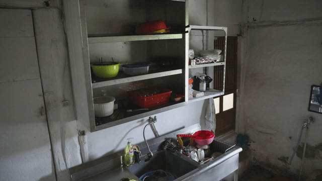 Simple kitchen with shelves and sink