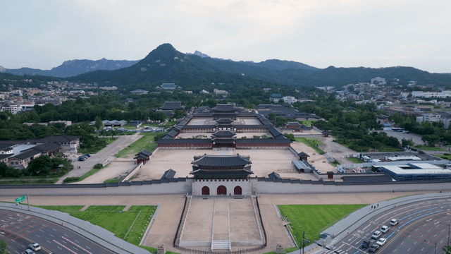 Historic palace with mountains in the background