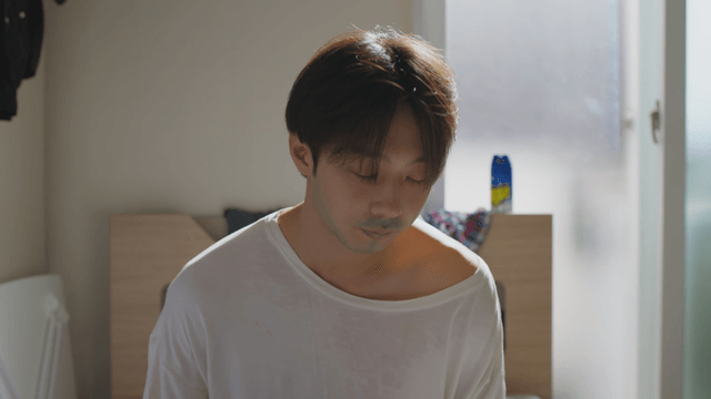 Tired man sitting in a sunlit room