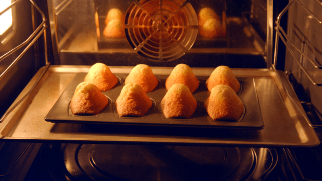 Freshly baked madeleines in the oven