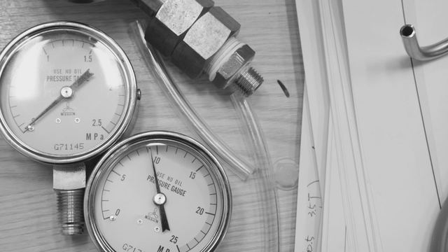 Pressure gauges and tubing on a table