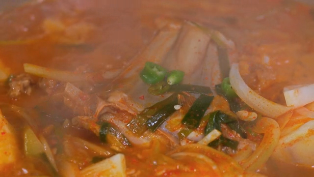 A pot of spicy stew boiling