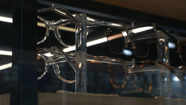 Display of various eyeglasses on a rack