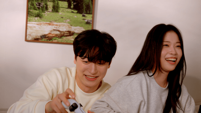 Couple playing video console game together