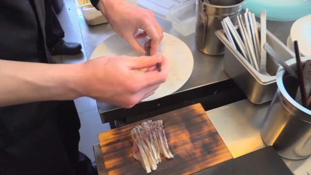 Chef preparing a dish in a kitchen