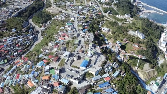 A coastal village with colorful rooftops