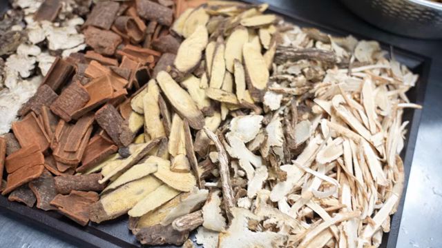 Various dried herbs on a tray