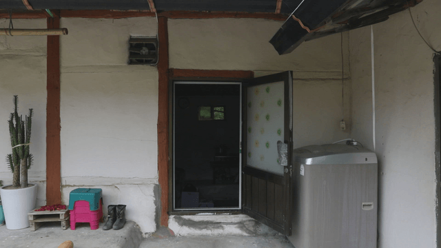 Rural house entrance with open door