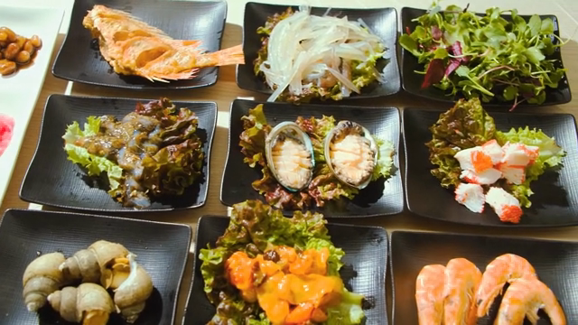 Various seafood dishes on plates