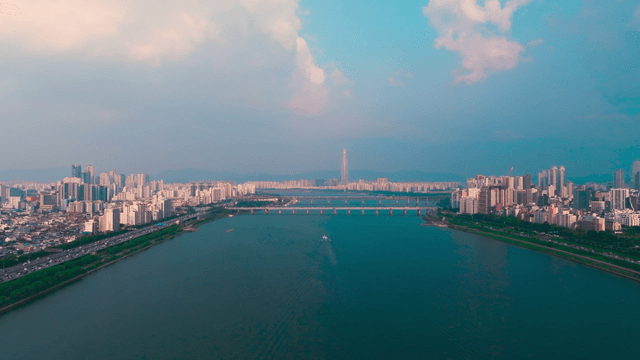 Vast Han River beneath bridge connecting Seoul