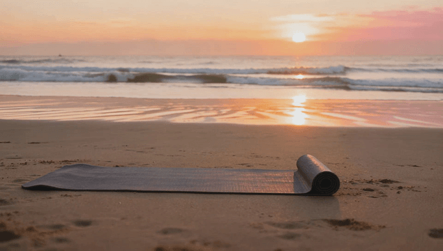 Yoga mat on a serene beach at sunrise