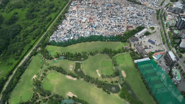Aerial view of a golf course and city
