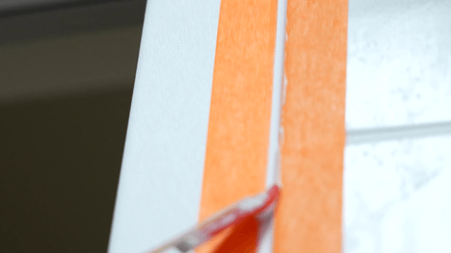 Smoothing sealant between masking tapes