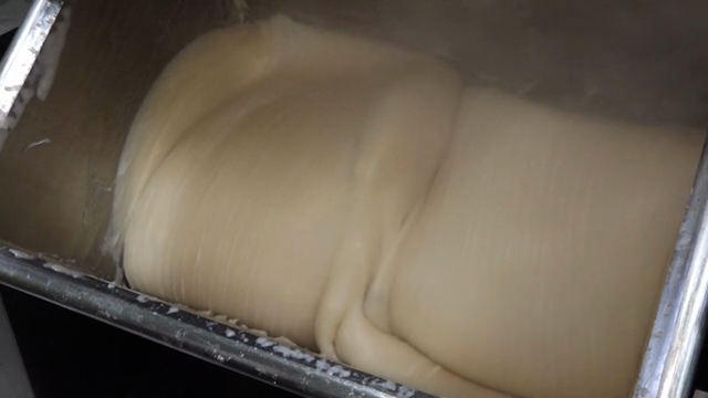 Dough being kneaded in a machine