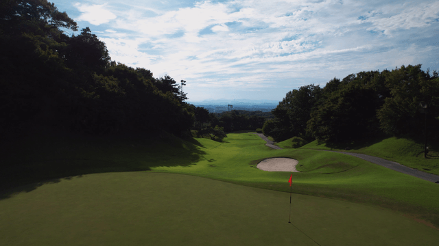Serene golf course under a clear sky
