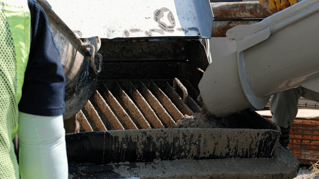 Concrete being poured into a mixer