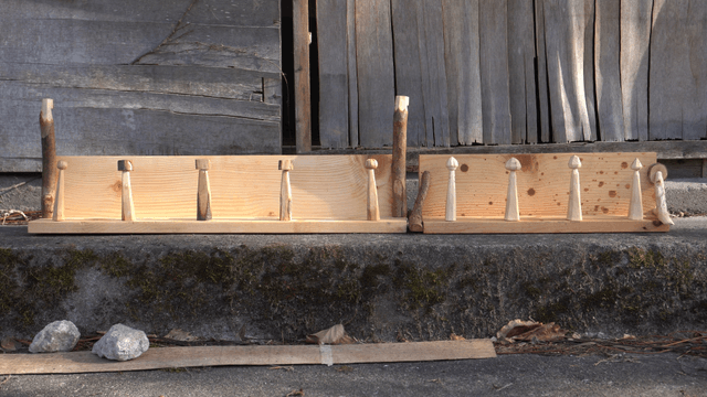 Wooden shelf on a concrete surface