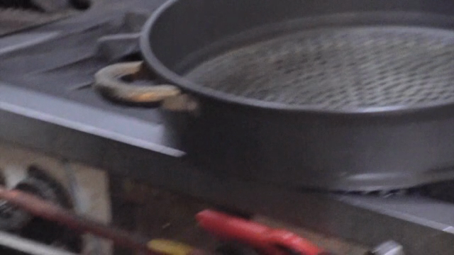 Mixing potatoes and eggs in a large pot