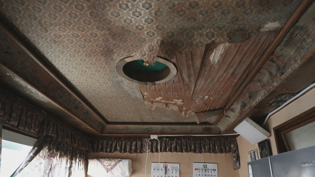 Old room with damaged ceiling