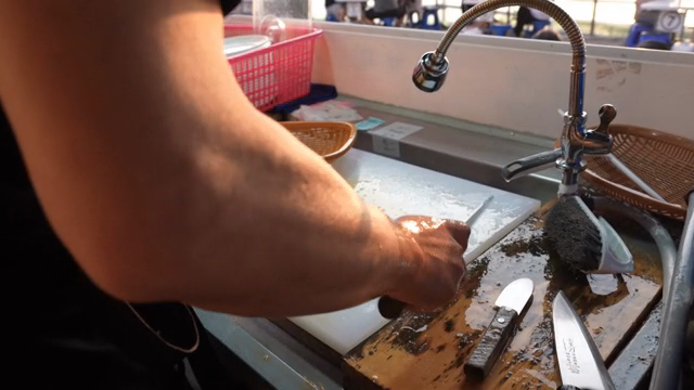 Preparing seafood outdoors