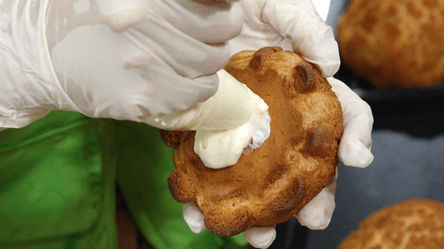 Cream being filled into a pastry