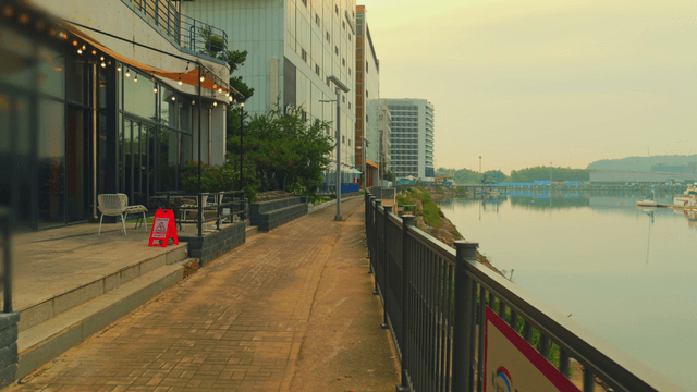 Riverside promenade with modern buildings