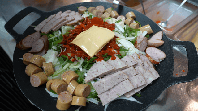 Uncooked budaejjigae with cheese added