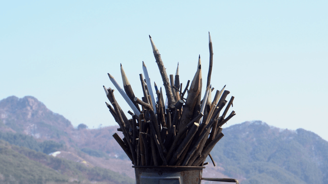 Wooden pencil carving with mountain background