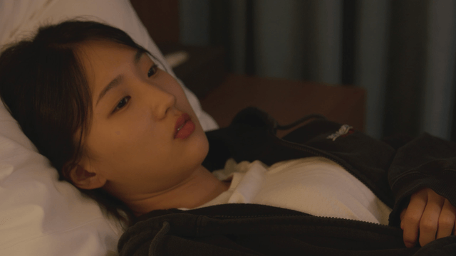 Woman lying in bed and waking up